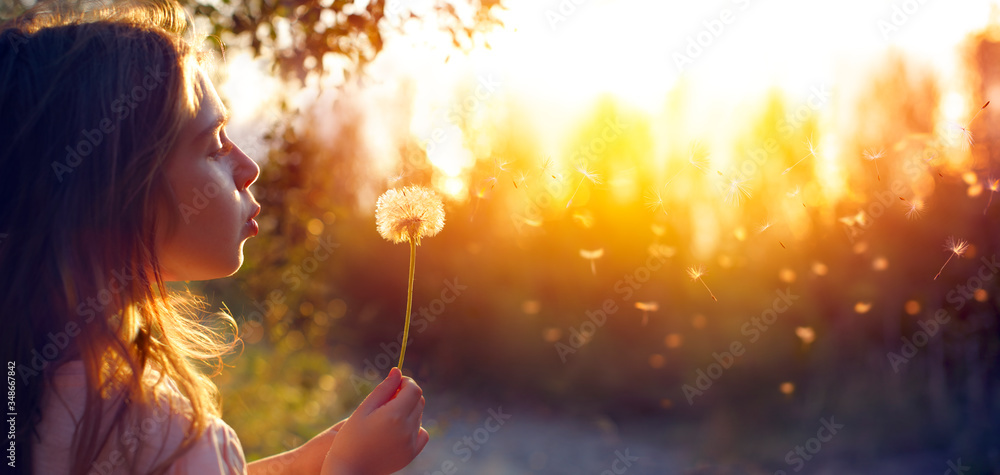 Little Girl Blowing Dandelion Flower At Sunset - Defocused Background
 - obrazy, fototapety, plakaty 