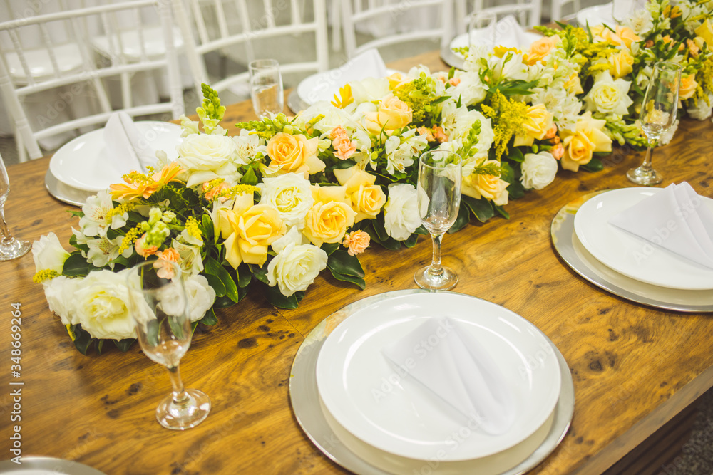 Fototapeta premium community table decorated with flowers for buffet 