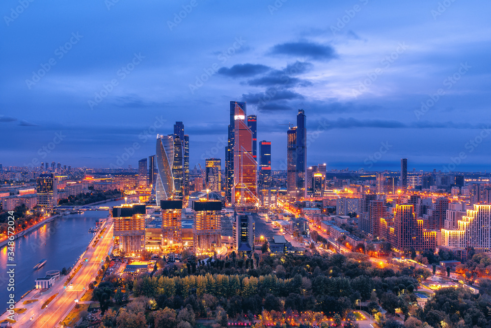Obraz premium Moscow city landscape from a height. Buildings of the Moscow City business center at dusk. Night illumination of the city.