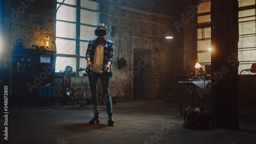 Talented Female Artist Wearing Virtual Reality Headset and Holding Digital Joysticks. She's Working on a Painting or Sculpture, Uses Motion Controllers To Create Concept Art. Creative Modern Studio.