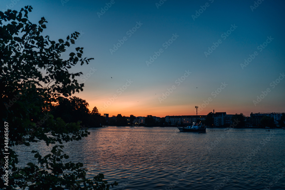 Naklejka premium photo of a landscape of a lake at sunset