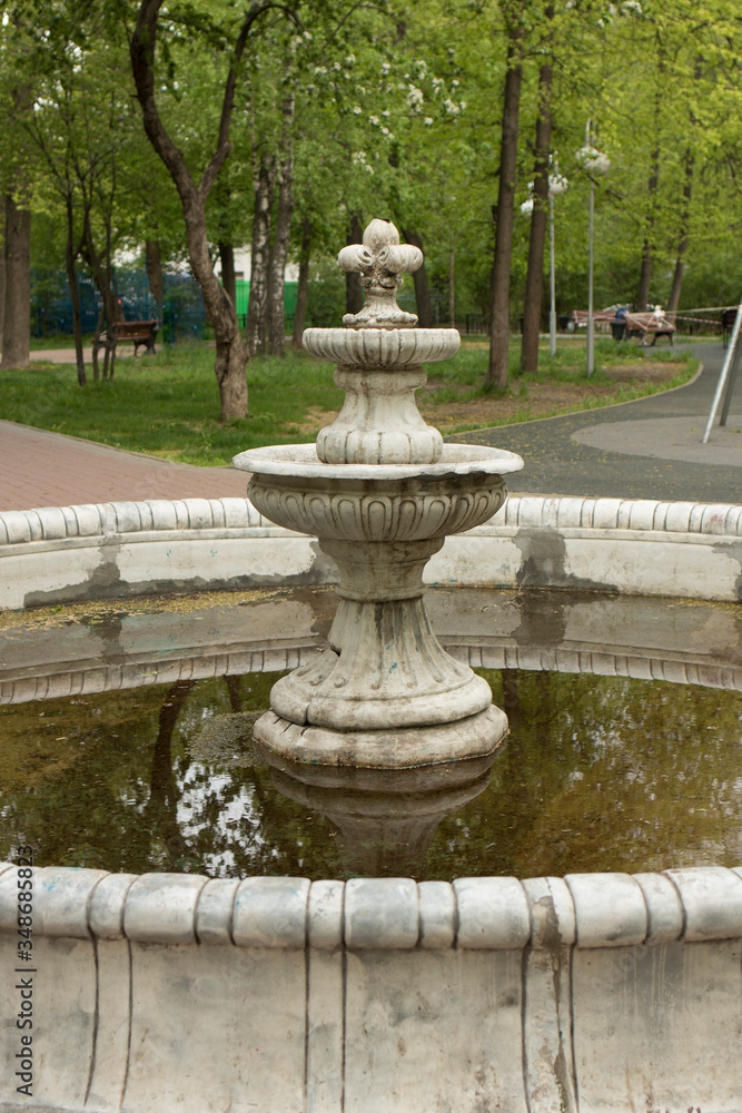 Old abandoned fountain in the park