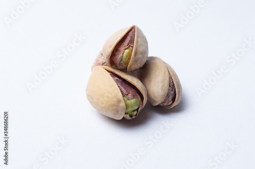 Roasted pistachios on white background