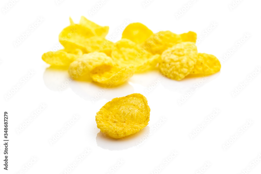 Breakfast cereal corn flakes on white. Cereal Healthy Cornflakes - snack breakfast best with milk. Dieting and detoxication concept with mineral nutrients. Macro close-up shot. Breakfast cereal corn flakes on white. Cereal Healthy Cornflakes - snack breakfast best with milk. Dieting and detoxication concept with mineral nutrients. Macro close-up shot.