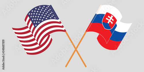Crossed and waving flags of Slovakia and the USA