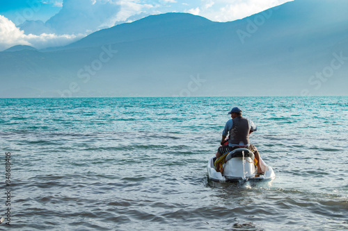 men practicing water sports on the lake of Coatepeque in El Salvador, Central America