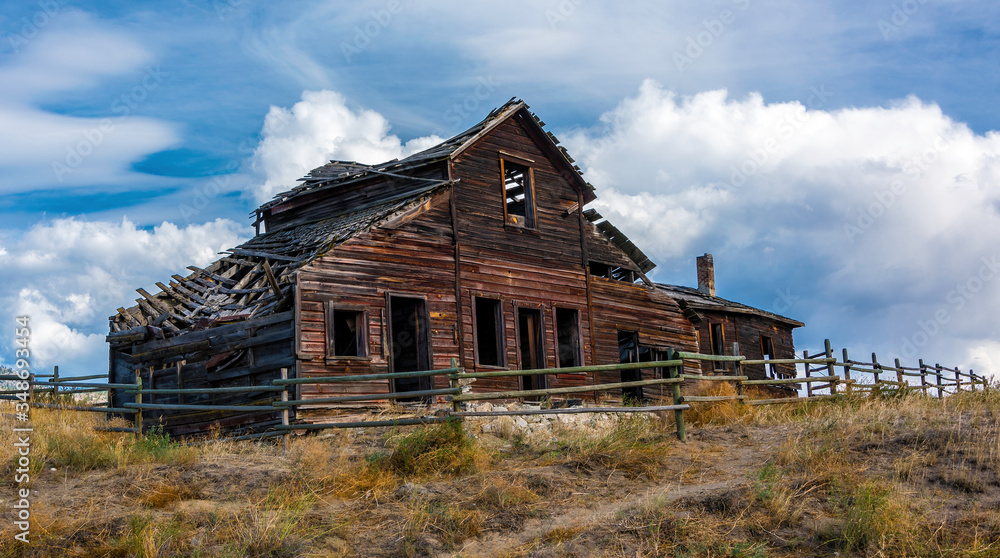 An old broken-down abandoned wooden home in the Okanagan valley Canada An old broken-down abandoned wooden home in the Okanagan valley Canada