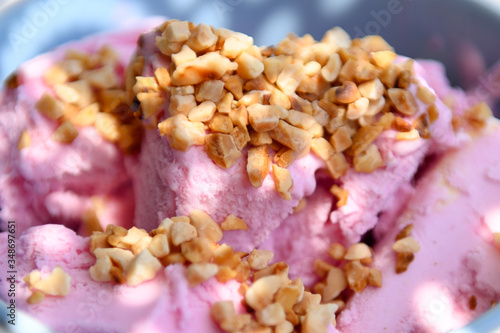 Strawberry ice cream with nuts. The taste of summer.