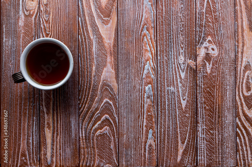cup of tea on a wooden background. copy text. wooden table in a Parisian cafe.