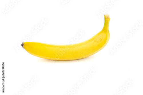 Single banana isolated. One yellow natural tasty banana on a white background.