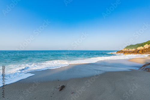 Fototapeta Naklejka Na Ścianę i Meble -  Waves on the summer beach in Dalugang, Xiyong, Shenzhen