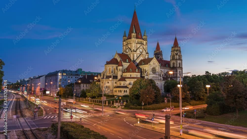 Day to night time lapse view of historical landmark St Francis of Assisi Church aka Mexico Church on Mexikoplatz in Vienna, Austria, zoom in. Day to night time lapse view of historical landmark St Francis of Assisi Church aka Mexico Church on Mexikoplatz in Vienna, Austria, zoom in.
