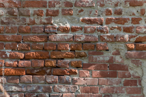 Old brick wall with cement traces and chips. brick texture  background