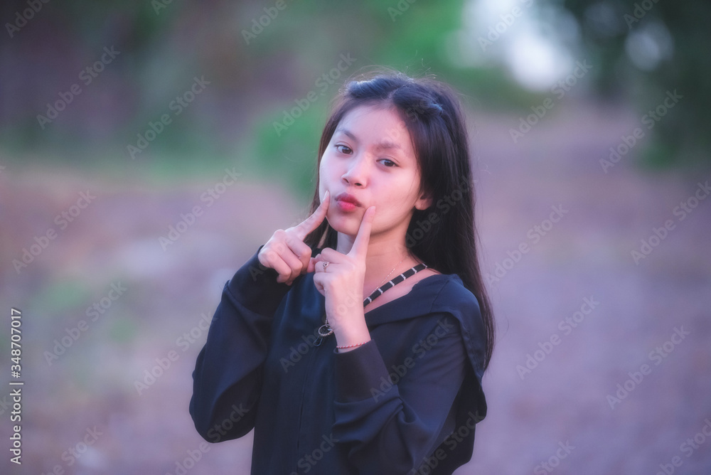 The girl shows a happy gesture. The girl shows a happy gesture.