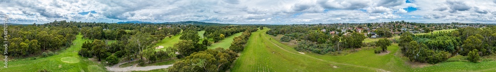 Wide aerial panorama of Rowville Golf Course and reserve in Melbourne, Australia