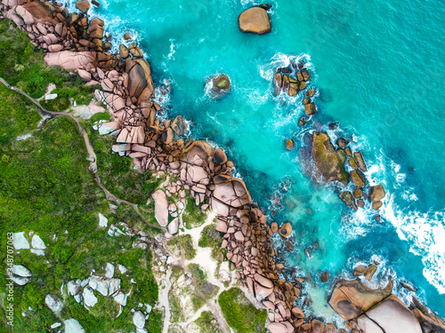 Aerial shot of the ocean and rocks.