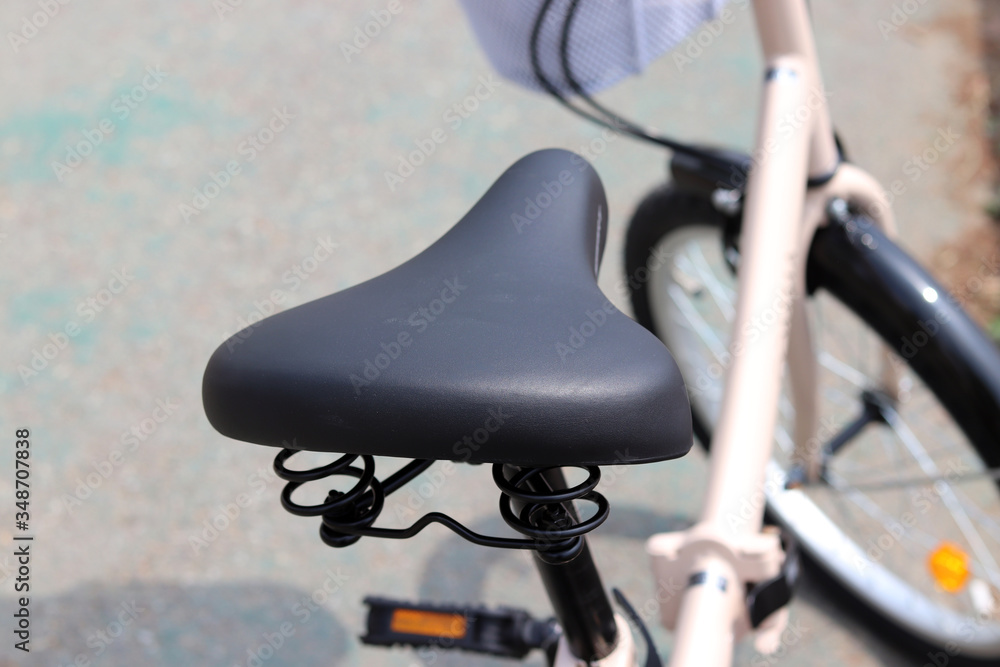 A close-up image of a bicycle saddle.
A close-up image of a bicycle saddle.
