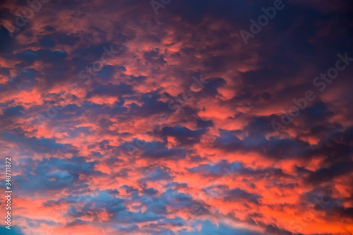 Beautiful sky at sunset. Purple and pink unusual clouds. Blurred background for design. © Galina Atroshchenko
