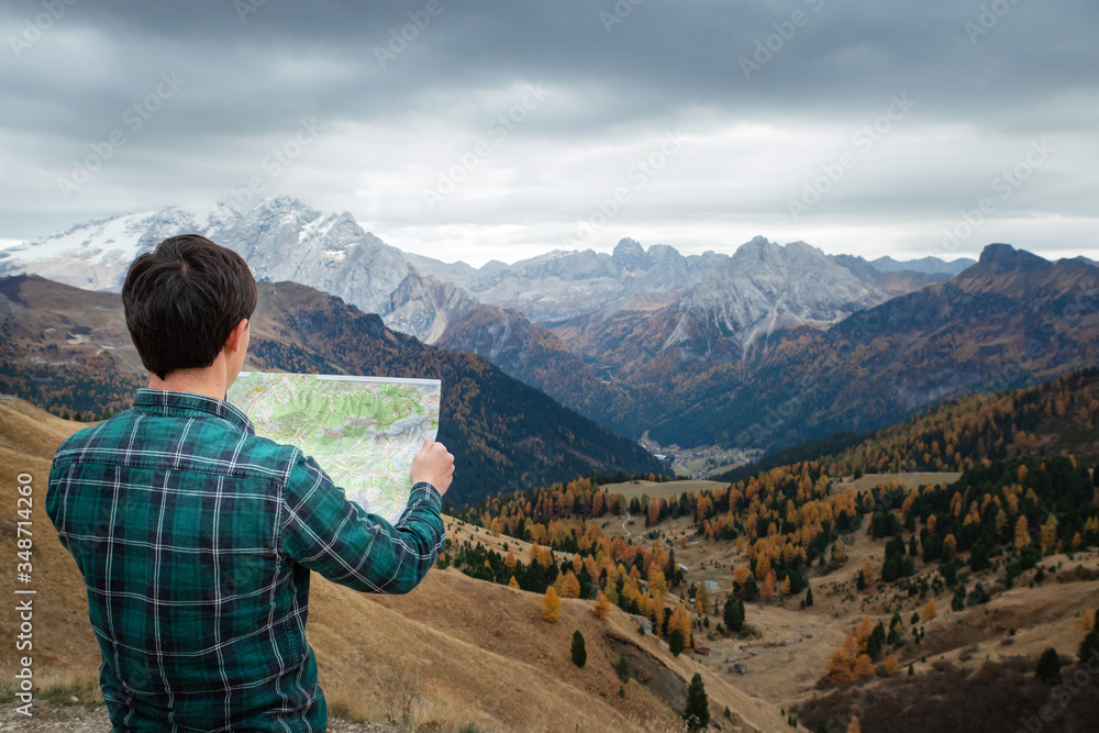 young man in the mountains. Hiking concept, lifestyle, traveler. Italian Alps, Dolomites