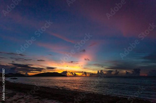 Gorgeous colorful sky at sunset on the beach © Adrienne
