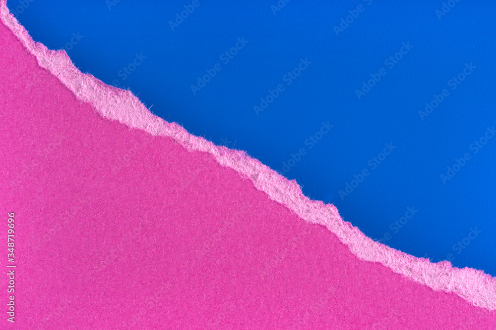 Torn purple paper edge on blue background. Ripped paper piece edge isolated with soft shadow. - obrazy, fototapety, plakaty 