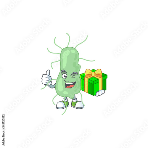 Happy smiley salmonella cartoon mascot design with a gift box