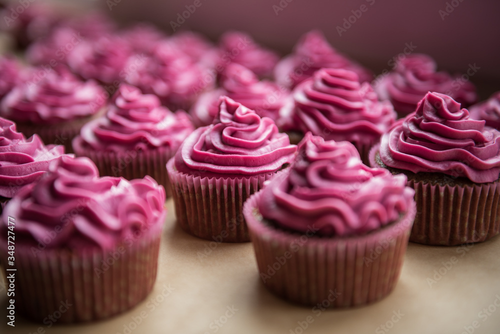 Chocolate cupcakes with raspberry cream on top