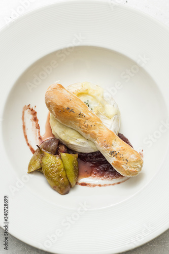 Cooked cheese ball with white bread stick