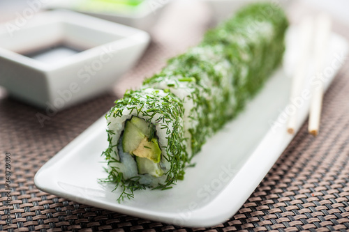 Uramaki sushi vegi green maki on a dish