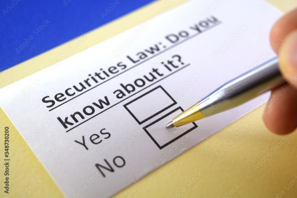 One person is answering question about securities law. One person is answering question about securities law.
