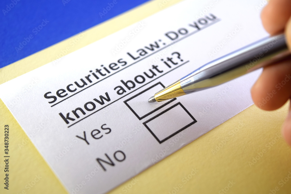 One person is answering question about securities law. One person is answering question about securities law.