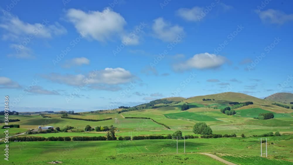 Time-lapse panorama of a farm in Dunedin, New Zealand, rolling clouds and hills Time-lapse panorama of a farm in Dunedin, New Zealand, rolling clouds and hills