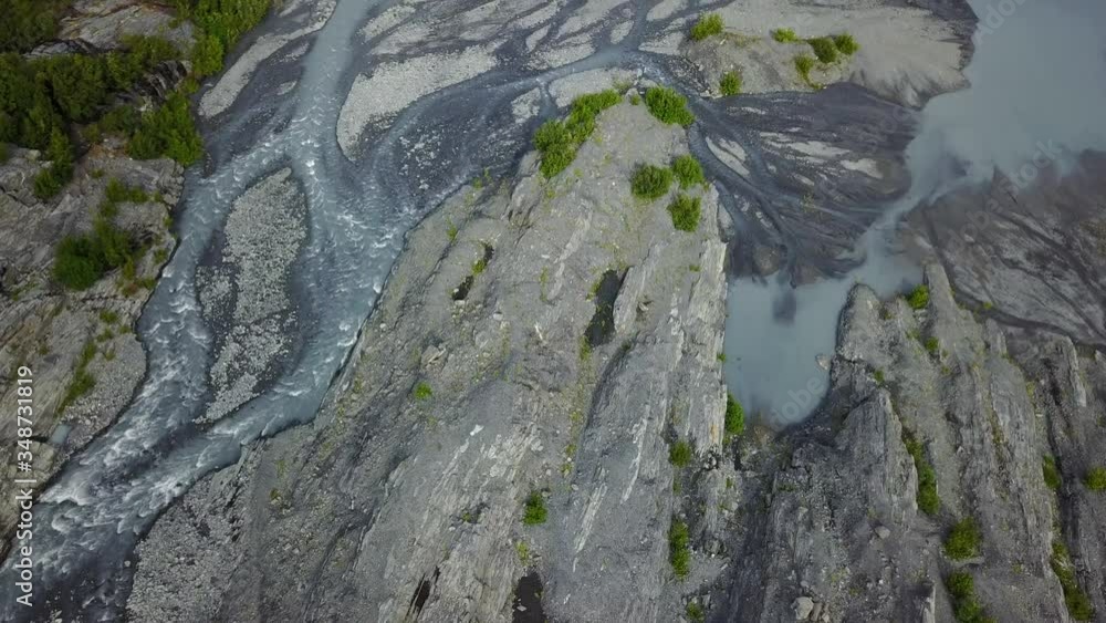 Aerial god view fly over, silt and mud filled lush green fertile glacier river delta, Alaska Aerial god view fly over, silt and mud filled lush green fertile glacier river delta, Alaska