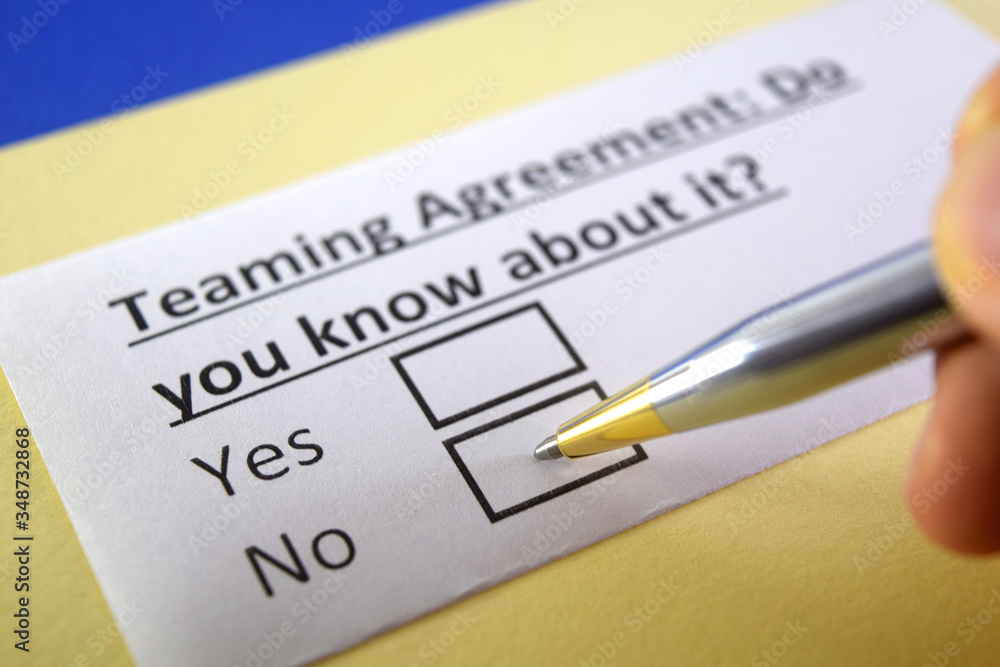 One person is answering question about teaming agreement. One person is answering question about teaming agreement.