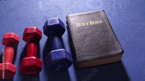 Colorful Gym Weights and Holy Bible 