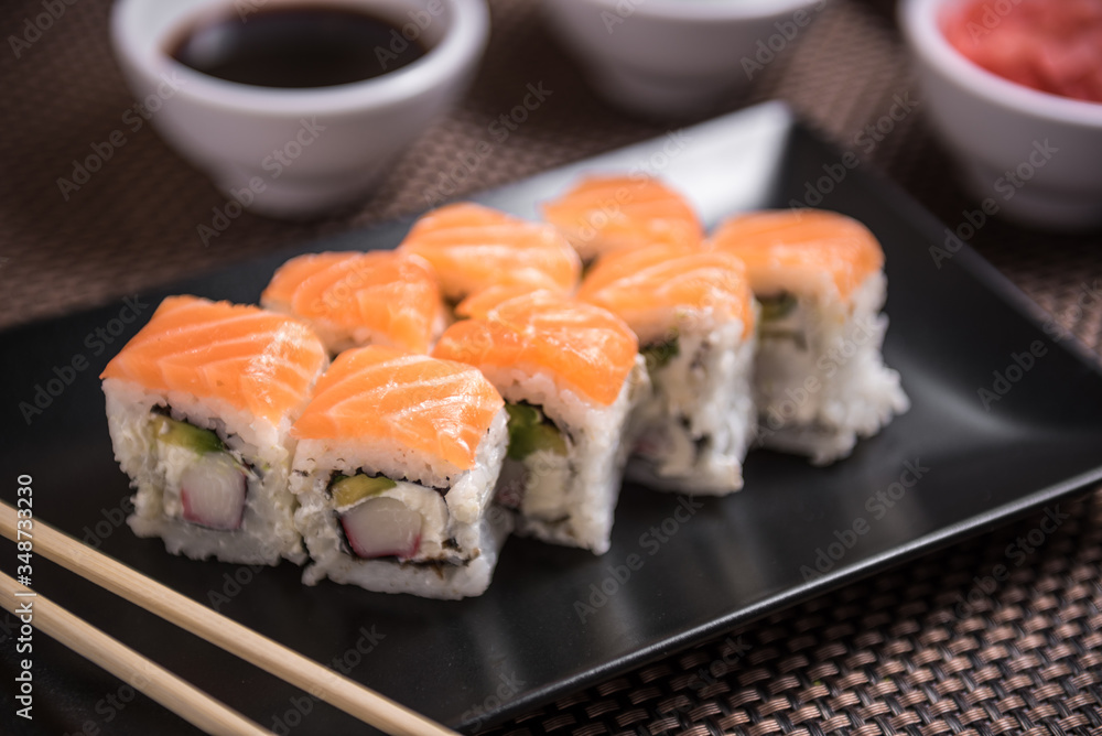 Sushi maki Hakuda maki with salmon, surimi crab Sushi maki Hakuda maki with salmon, surimi crab