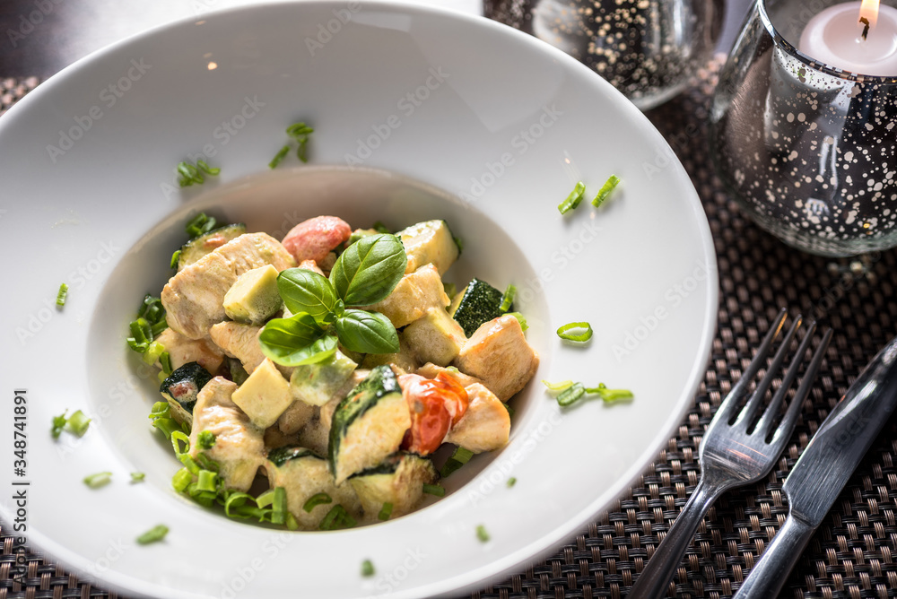 Cooked Chicken pieces with cooked vegetables