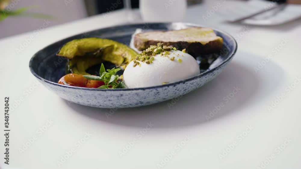 Woman serving a dish with delicious food Woman serving a dish with delicious food