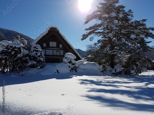 house in the winter snow