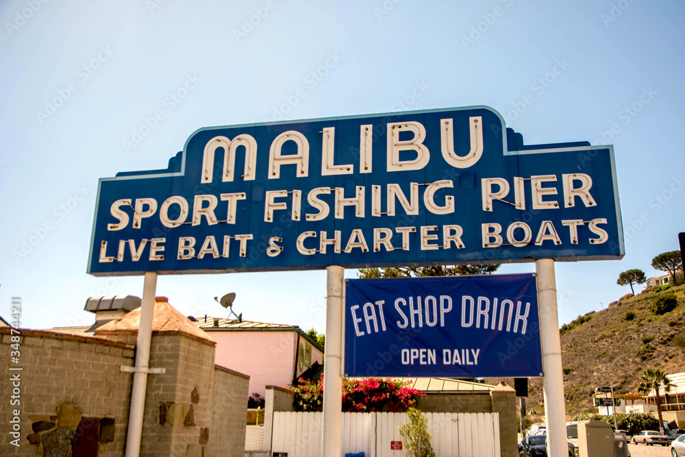Malibu, California, Year 2016: Malibu Beach Pier signpost. Sport fishing pier. Vacations.