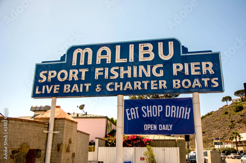Malibu, California, Year 2016: Malibu Beach Pier signpost. Sport fishing pier. Vacations.