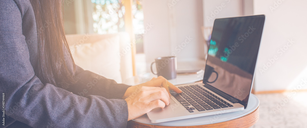 Business women hand use laptop computer.