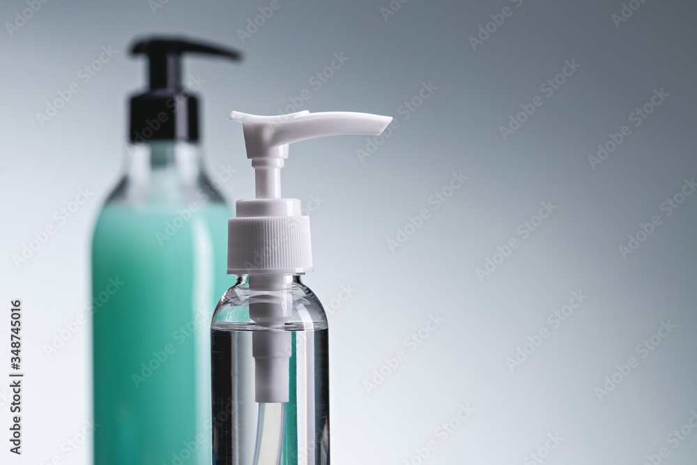 Hand sanitizers, protection against viruses and bacteria. Two bottles of spray, gel and alcohol antiseptic. Close-up, copy space. Hand sanitizers, protection against viruses and bacteria. Two bottles of spray, gel and alcohol antiseptic. Close-up, copy space.