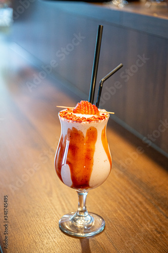 Ice cream milk shake with caramel and two straws