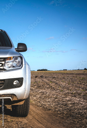 Front view of a Pick up truck in the field. Work vehicle.