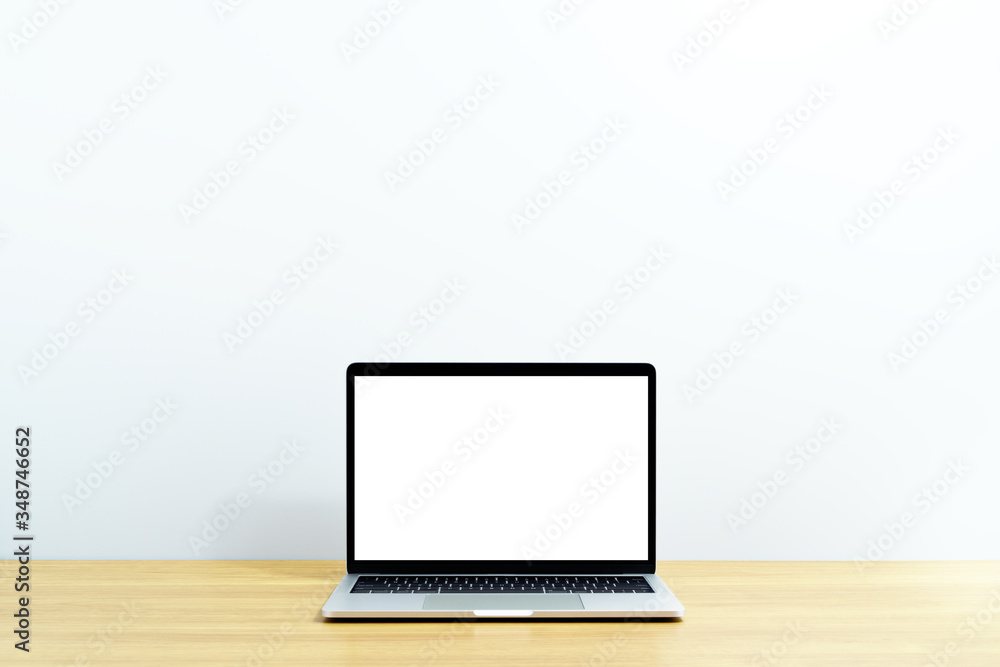 Laptop computer on wood table. Laptop with blank screen. White background. Laptop computer on wood table. Laptop with blank screen. White background.