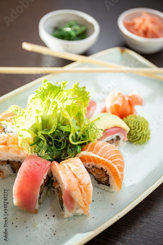Sushi circle with uramaki sushi, salmon, tuna, eel