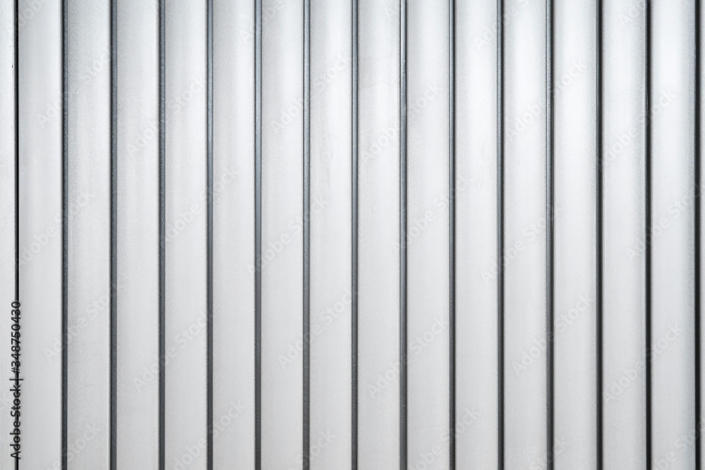 White Corrugated metal texture surface in the vertical line background or texture White Corrugated metal texture surface in the vertical line background or texture