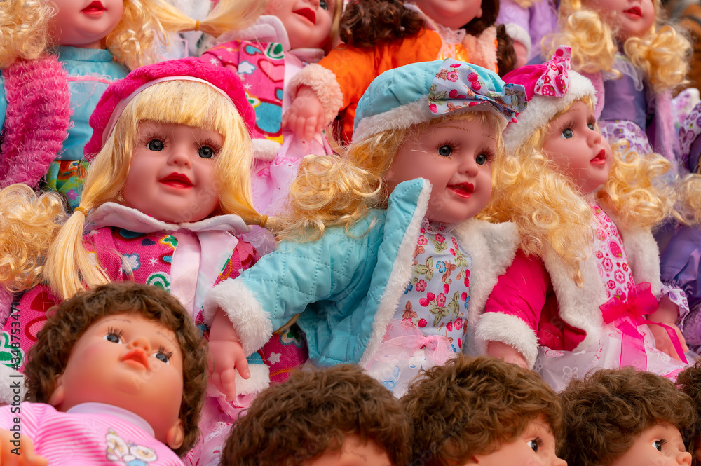 Nice little girl cute baby dolls for sale at retail shop at Christmas market, New Market area, Kolkata, West Bengal, India. Nice little girl cute baby dolls for sale at retail shop at Christmas market, New Market area, Kolkata, West Bengal, India.