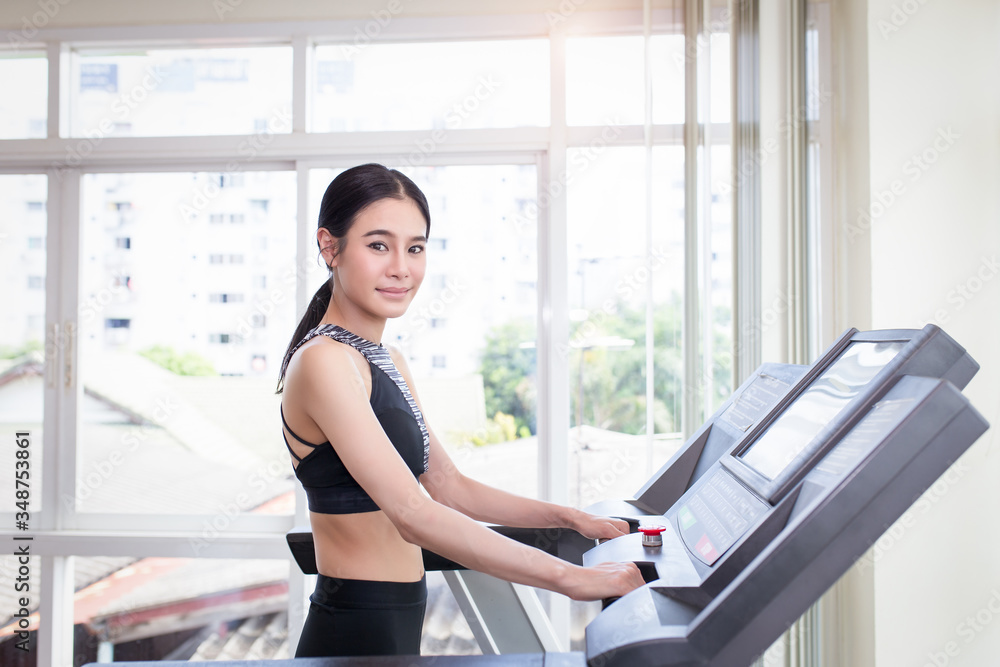 Young sports asian woman is working out in gym. Young sports asian woman is working out in gym.